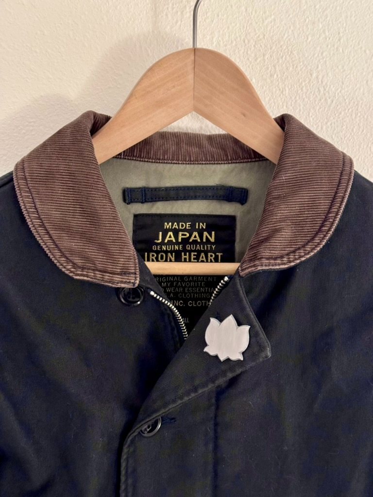 A prototype mounted on a jacket hanging against a wall