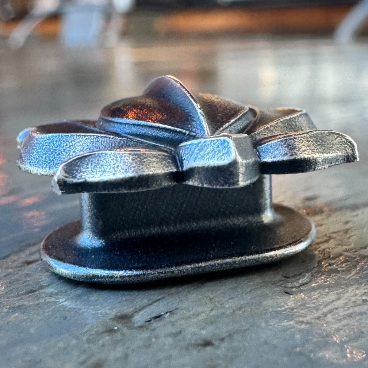 The stem from a low angle, showing the bar beneath the lotus face